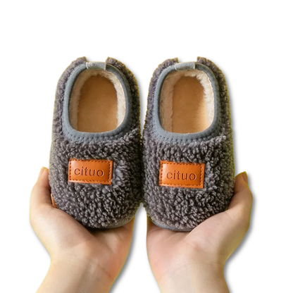 Plush fleece baby shoes designed for infants, featuring an anti-slip soft sole for new walkers