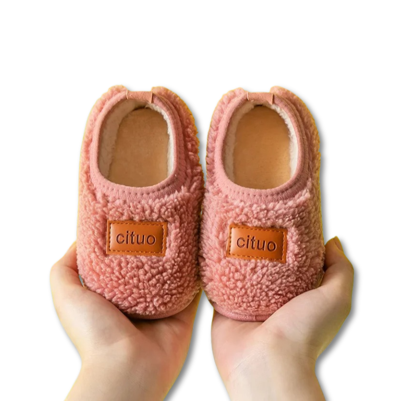 Pair of anti-slip infant walking shoes made with soft fleece, promoting healthy foot growth