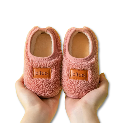 Pair of anti-slip infant walking shoes made with soft fleece, promoting healthy foot growth
