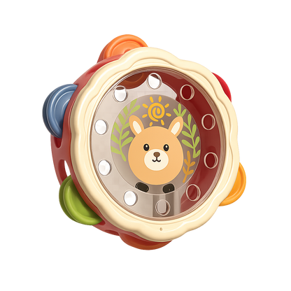Close-up of a baby's hand shaking a colorful animal-face tambourine toy, perfect for infant development.