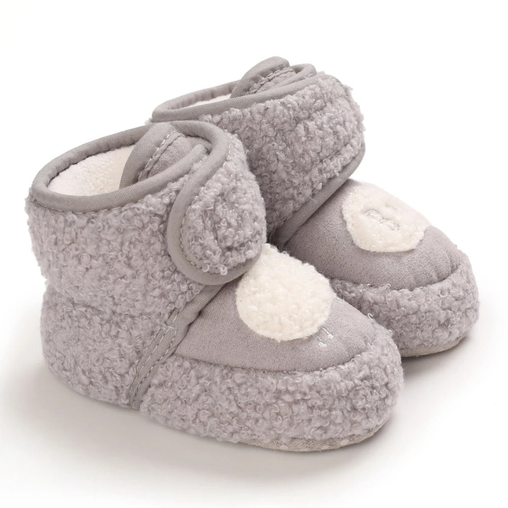 Infant winter shoes, adorable animal design, keeping tiny toes snug and warm.