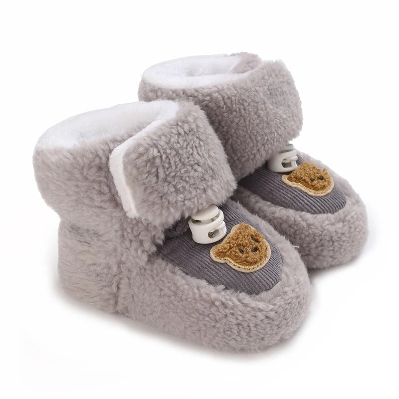 Soft baby animal winter shoes with non-slip sole for safe toddler steps.