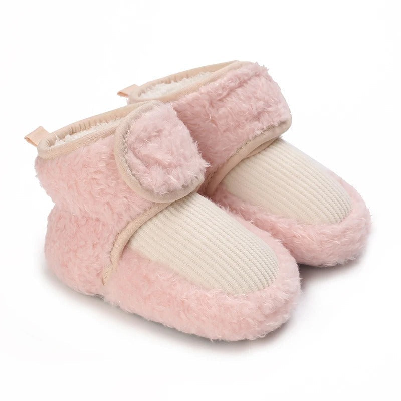 Warm children's winter shoes with a playful animal theme, great for toddlers.