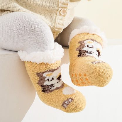 Stack of colorful warm terry anti-slip baby socks, including blue, pink, and grey, essential baby clothing.