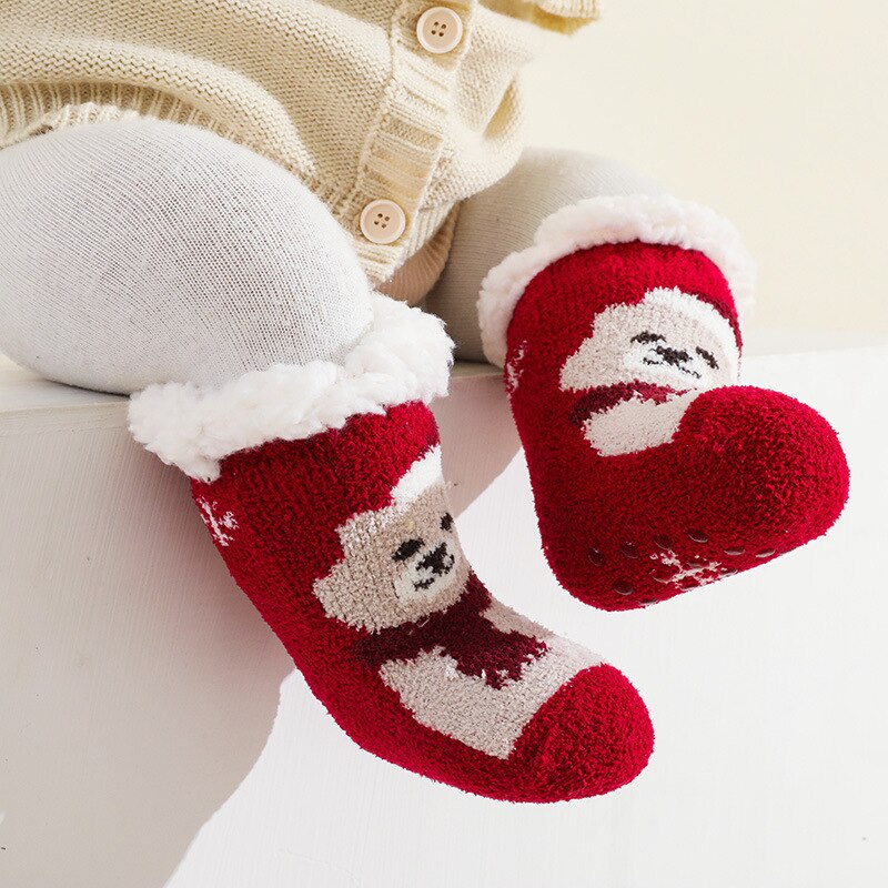 Detailed view of the anti-slip grip on the sole of a warm yellow terry baby sock, cotton infant apparel.