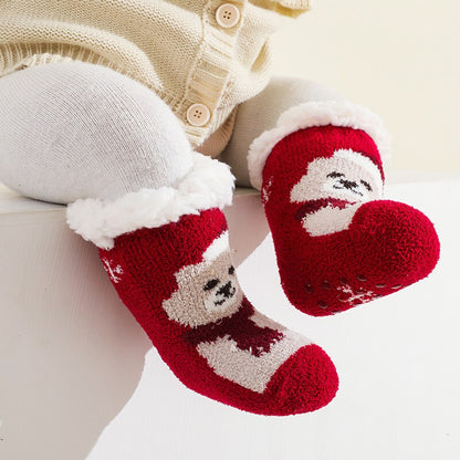 Detailed view of the anti-slip grip on the sole of a warm yellow terry baby sock, cotton infant apparel.