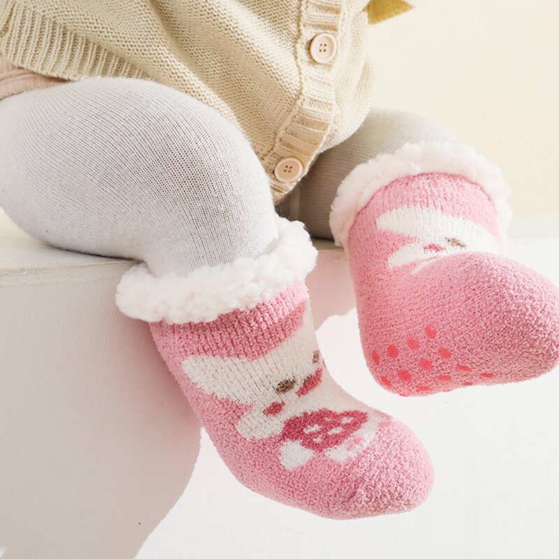 Assortment of warm cotton terry anti-slip baby socks for boys and girls, a newborn essential.