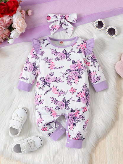 Cute baby girl in floral print long sleeve romper with matching bow headband, perfect newborn outfit.