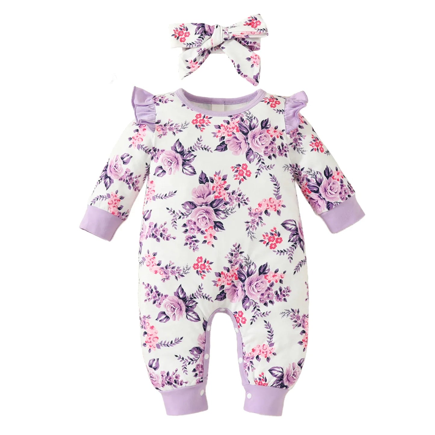 Cheerful baby girl wearing a vibrant floral romper and large bow headband, happy infant clothing.