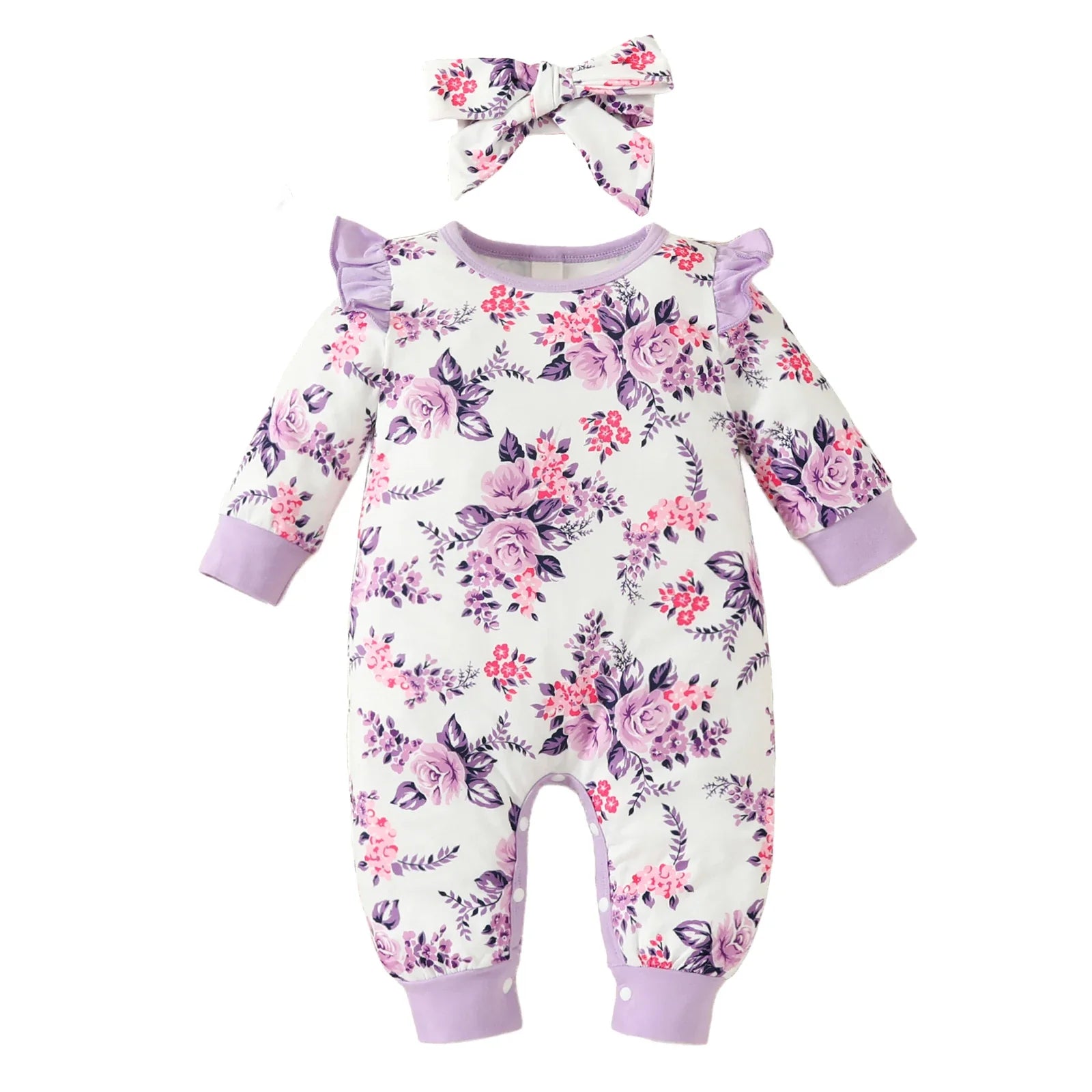 Cheerful baby girl wearing a vibrant floral romper and large bow headband, happy infant clothing.