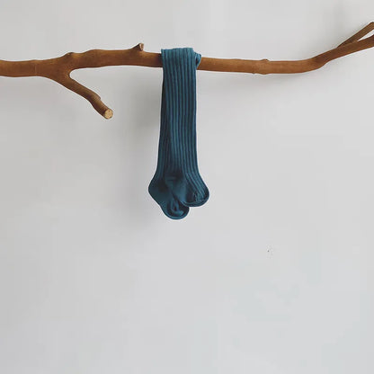 Display of various patterned cotton knit pantyhose, great addition to toddler stockings collection.