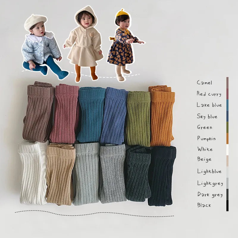 Close-up of a textured white cotton knit pantyhose, showing the soft fabric for infants and toddlers.