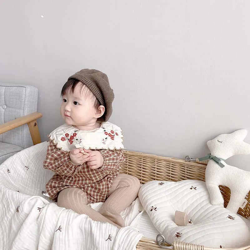 A pair of yellow cotton knit pantyhose for infants, essential baby girl fashion, warm and soft.