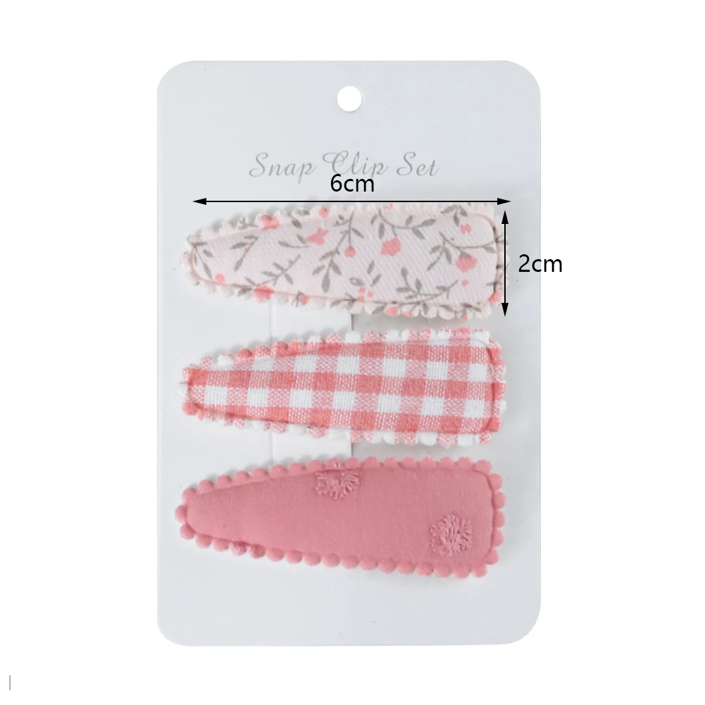 Colorful polyester flower print hair clips for baby girls. Stylish floral accessory for toddlers & infants.