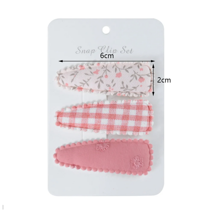 Colorful polyester flower print hair clips for baby girls. Stylish floral accessory for toddlers & infants.