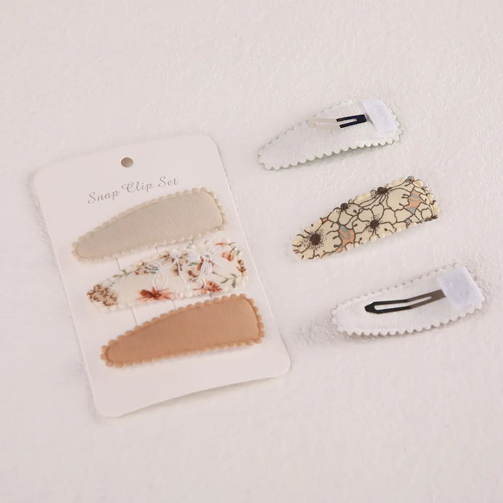 Stylish baby girl flower print hair clips. Cute floral infant accessories for toddler hair fashion.