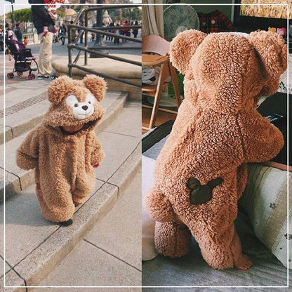 Cute baby in a soft beige polyester teddy bear hooded jumpsuit, perfect cozy winter outfit for infants.