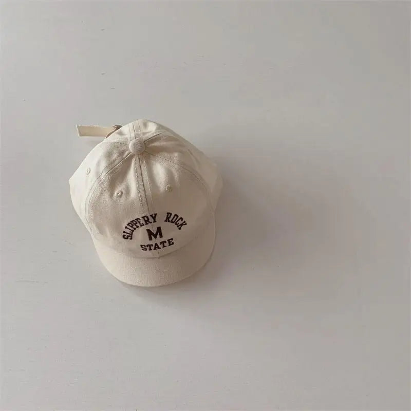 Embroidered baby baseball cap in soft cotton, adjustable for growing infants, toddler hat