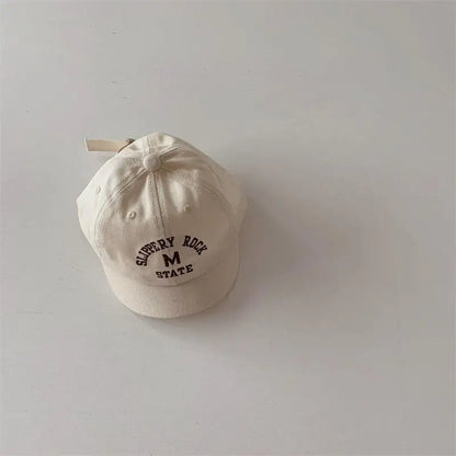 Embroidered baby baseball cap in soft cotton, adjustable for growing infants, toddler hat