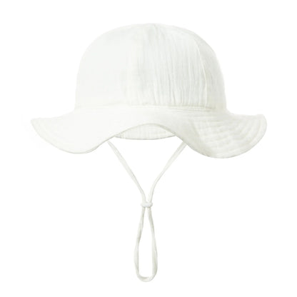 Top down view of a baby summer hat, showing the secure fit and durable cotton material.