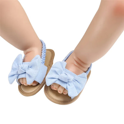 Sky blue baby sandals with a natural cork sole, offering soft and supportive infant footwear for babies.