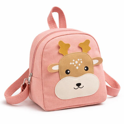 Close-up of a bear cartoon backpack with a child's hand reaching for zipper