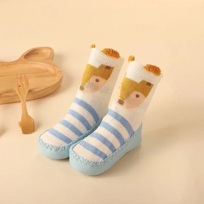 Colorful anti-slip floor socks for infants, decorated with cheerful cartoon animals.