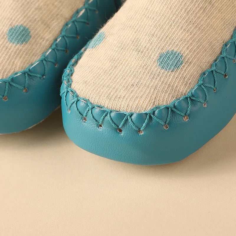 Playful anti-slip floor socks for infants, showcasing a friendly cartoon frog design.