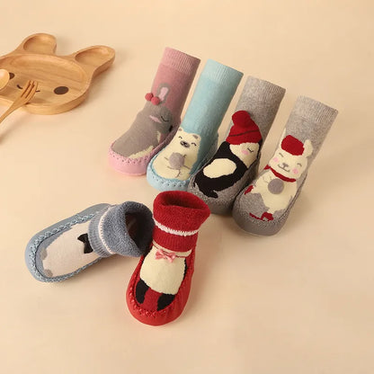 Comfortable anti-slip floor socks for toddlers, decorated with a whimsical cartoon cat.