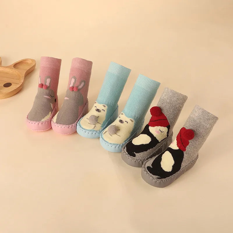 Adorable anti-slip floor socks for baby, featuring a cute cartoon pig character.