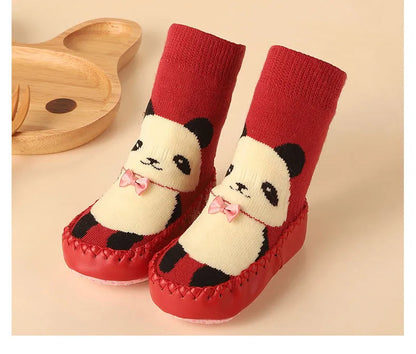 Vibrant anti-slip floor socks with a cartoon penguin, keeping baby's feet secure.