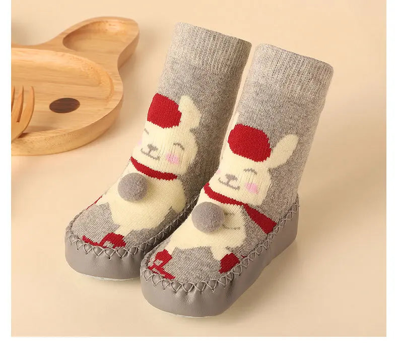 Kids anti-slip floor socks in a cute cartoon animal motif, super warm and grippy.