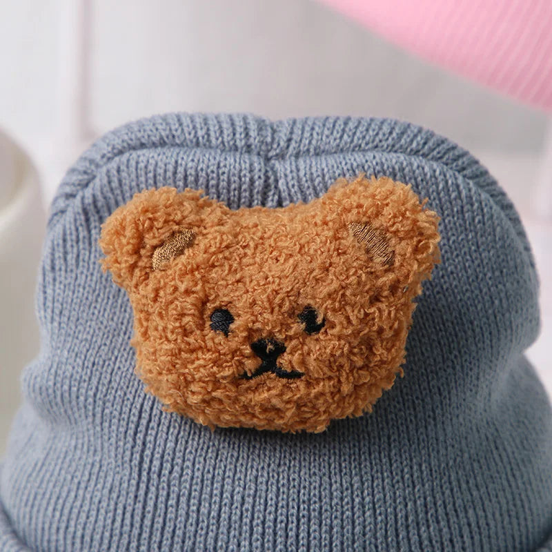 Handmade-style knitted bear hat, a warm and cute addition to baby accessories.