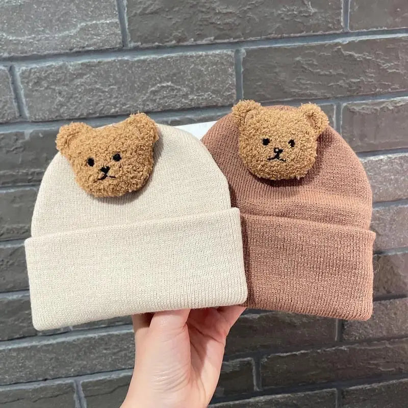 Soft knitted bear hat, perfect for keeping infants warm during cold winter months.