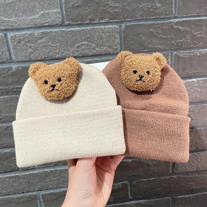 Soft knitted bear hat, perfect for keeping infants warm during cold winter months.