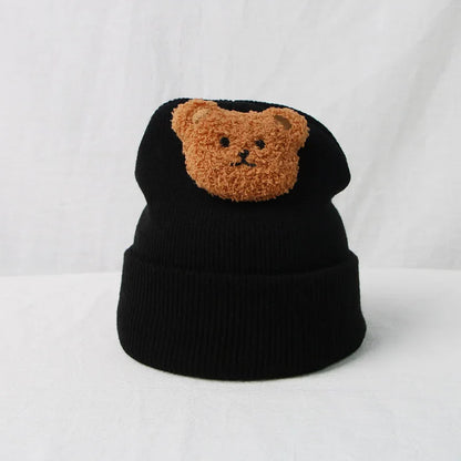 Winter-ready baby hat, handcrafted knitted design with a charming bear face.