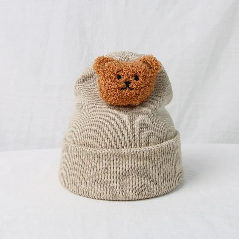 High-quality knitted toddler hat, featuring a cheerful bear and excellent warmth.