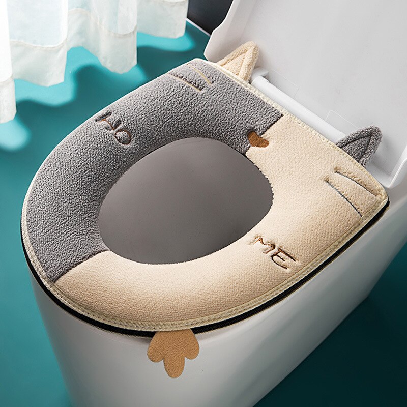 Kids' toilet seat cushion in cute cartoon cat design, featuring a handle for easy use & junior comfort