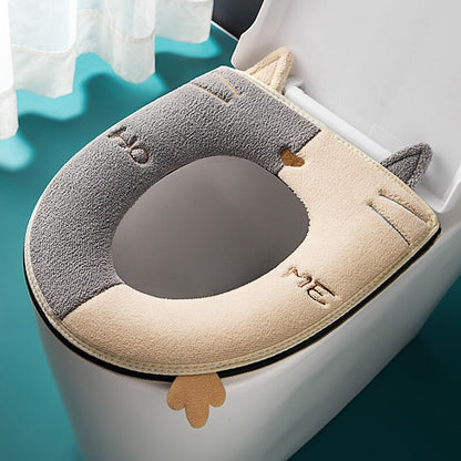 Kids' toilet seat cushion in cute cartoon cat design, featuring a handle for easy use & junior comfort