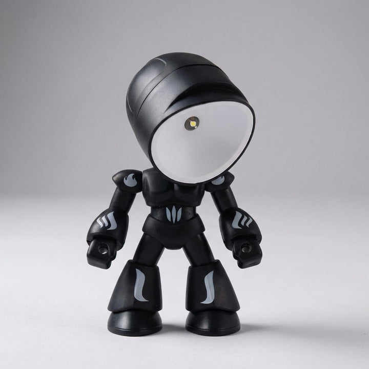 Compact Luminobot robot lamp for kids' bedside. Provides soft reading light & acts as a charming night light.