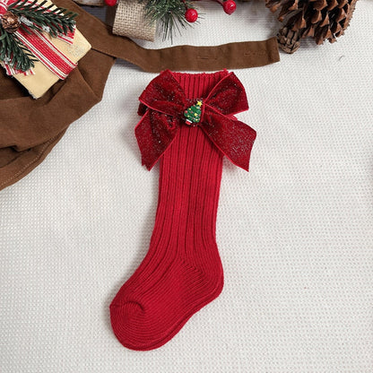 Red and white striped anti-slip socks with a Santa hat character for kids