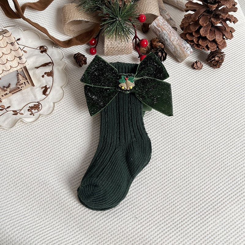 Holiday-themed anti-slip socks for toddlers, with a cute penguin character