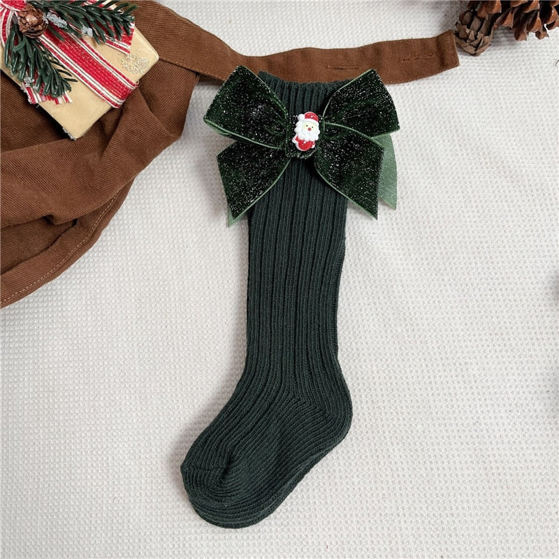 Adorable anti-slip socks for newborns with a small Christmas character, cozy