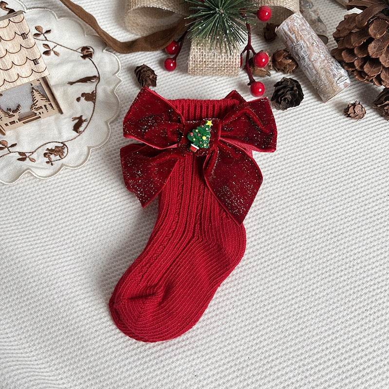Toddler's red anti-slip Christmas socks with reindeer character, festive apparel