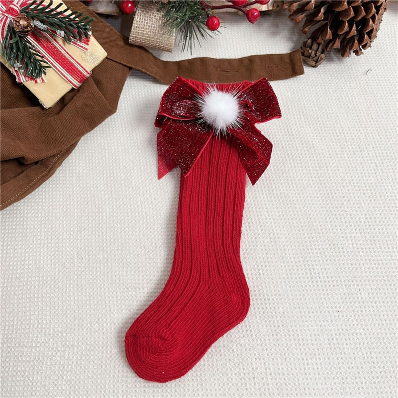 Green anti-slip baby socks featuring a Santa character, perfect holiday gift
