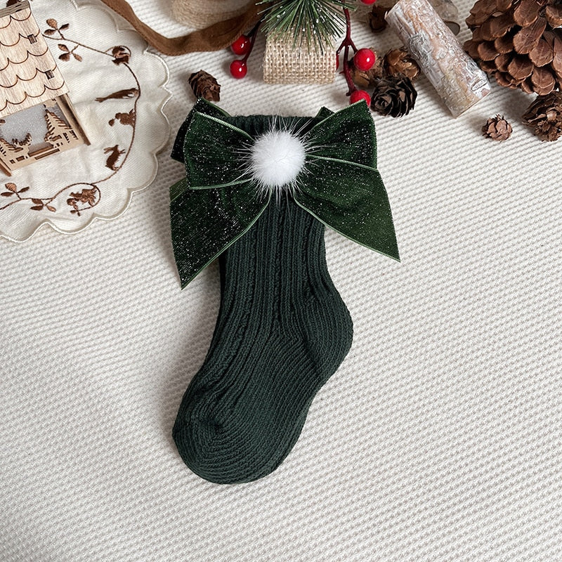 Children's apparel: a pair of cozy anti-slip Christmas socks with a bear design
