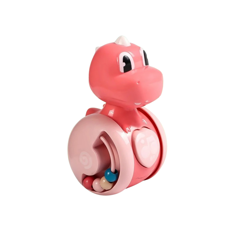 Baby reaching for a developmental rolling dinosaur toy, enhancing motor skills and interaction
