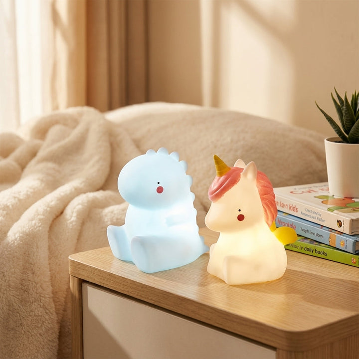 Cute Dreamasaur dinosaur LED night light, ideal for kids' bedroom & nursery. Soft glow sleep aid animal lamp.