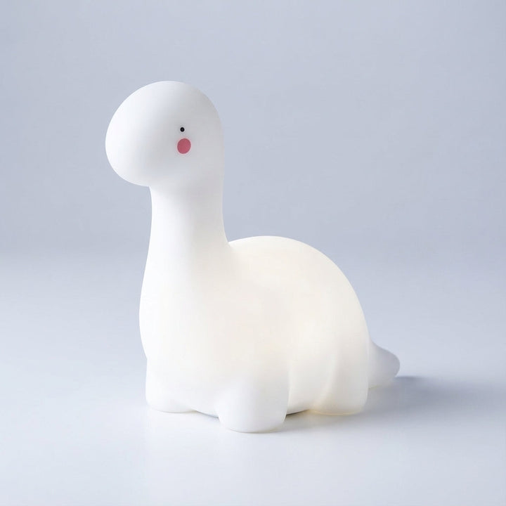 Dreamasaur LED night light, a charming dinosaur bedroom decor piece for children. Gentle glow & sleep aid.