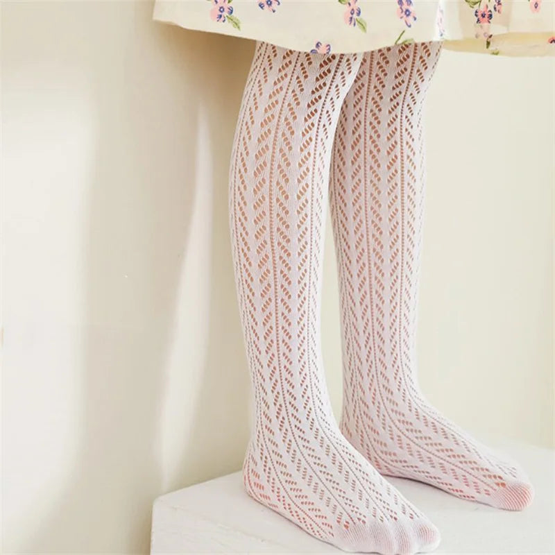 Toddler girl wearing light blue mesh thin summer pantyhose, ideal for summer fashion.